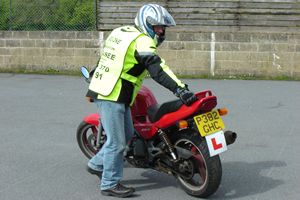 Manual handling of a big motorbike